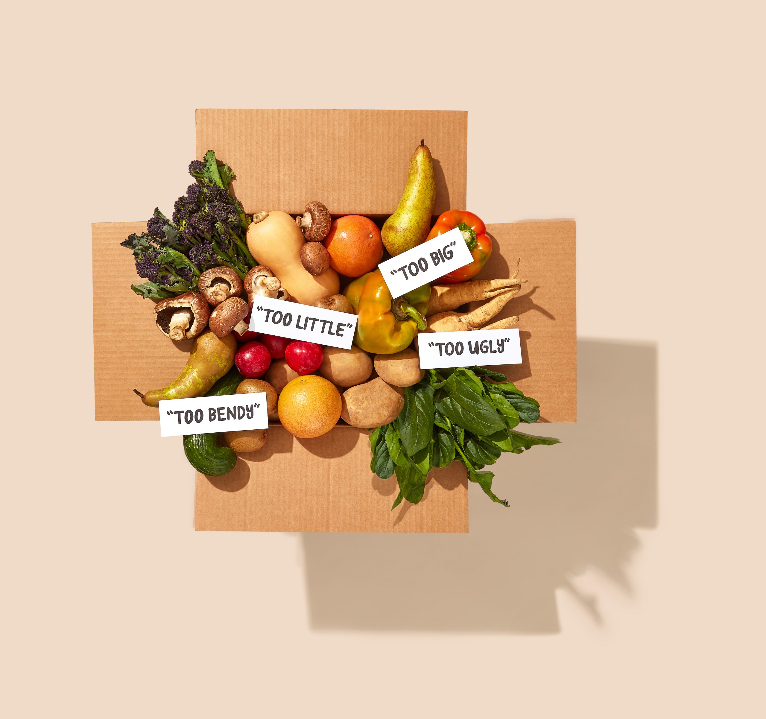 A variety of fruits and vegetables, labeled with tags like 