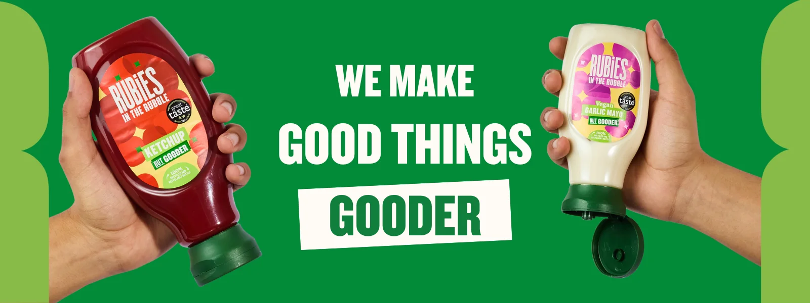 A banner with two hands holding Rubies in the Rubble Ketchup and Rubies in the Rubble Mayo with text in the middle saying 'we make good things gooder'.